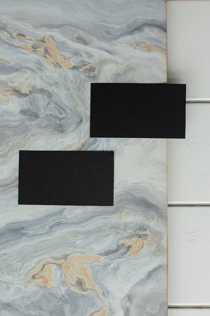 Blank business cards on marble surface